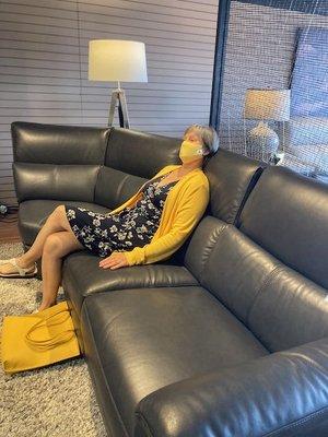 Therese H. tries out the sectional sofas.