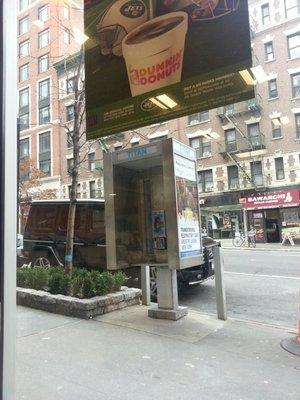 One of few phone booths left in NYC