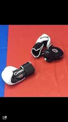 Revgears gloves and mits on my mats being used by MMA class