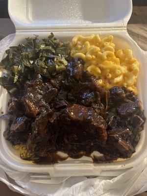 Oxtails rice mac and cheese collard greens