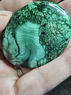 Beautiful Malachite palm stone. It feels very comforting in my hand. I just love the changes in the pattern and many shades of green.