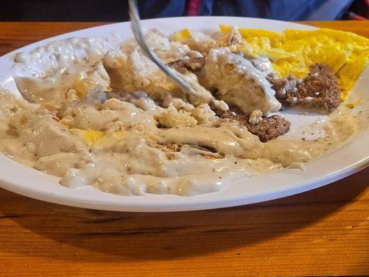 Biscuits and gravy with eggs and sausage.  This was taken after I had already eaten about half of it!!!