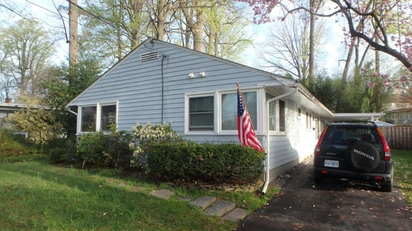 This is the before photo, a lot of prep work went into trying to get the siding to look good again!