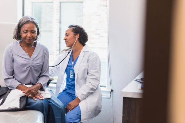 Female physician providing a check up.