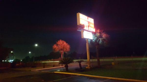 Inn sign at night