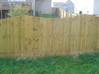 Standard privacy fence with Cape Cod top cut by B & B Fencing