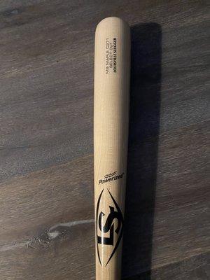 Notice how the bat is brand new - no damage from baseballs