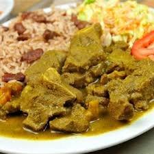 Curry Goat Dinner served with White Rice or Rice & Red Peas. Steamed Veggies and Sweet Plantains,)