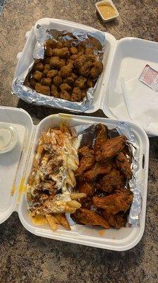 Wet lemon pepper wings, Ranch Cheese Bacon Fries, and fried okra. Delicious!