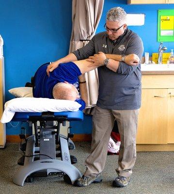 Dave, using manual therapy on a patient