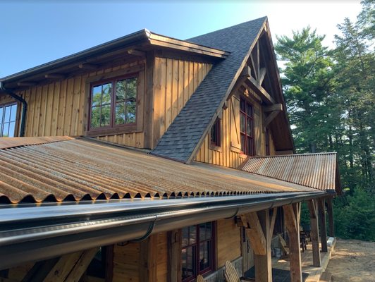 A cabin with half round gutters and covers