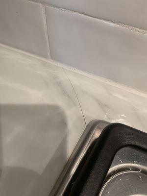 Crack in porcelain counter top. Less than 6 months old.