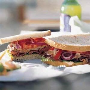 Roast beef, bacon, horseradish, lettuce and tomatoes on Italian bread