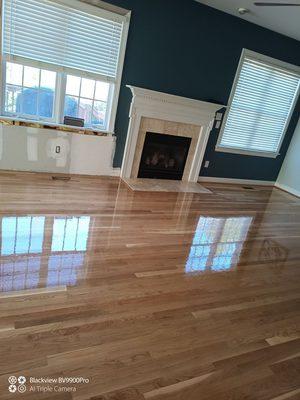 Room painted and hardwood floor refinished.