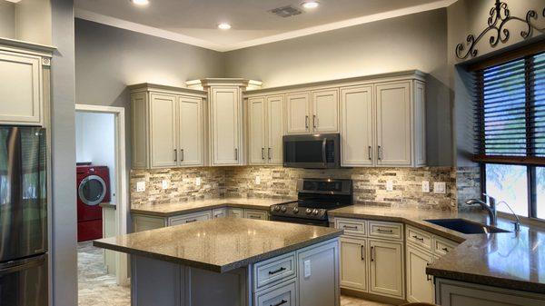 Beautiful Cream with Glaze Cabinetry, stacked Crown Molding