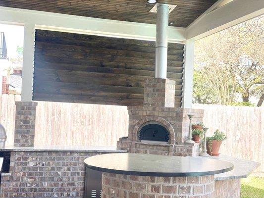 Outdoor kitchen with a wood burning pizza oven!!!