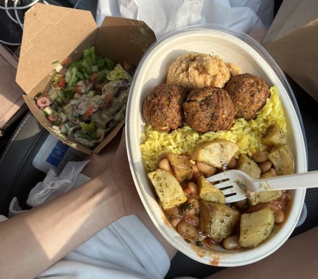 plate with "greek salad" (Beans & saffron rice, lemon potatoes, hummus with falafel)