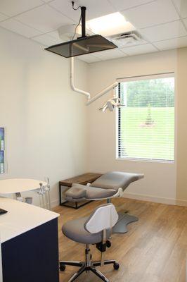 Patient room for cleanings and exams with overhead tv in each room!