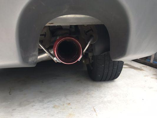 Custom cherry bomb muffler installed and welded on.