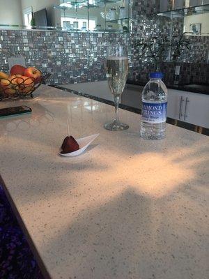 Champagne and chocolate strawberries and water