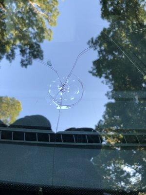 BUSTED WINDSHIELD BY DEBRIS FROM JM ROLLOFF