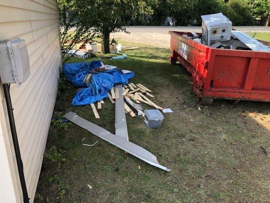 Trash and supplies in our flower beds.