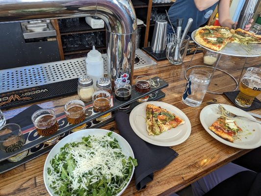 Arugula salad and caprese pizza