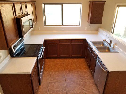 Neutral white and grey countertop resurface