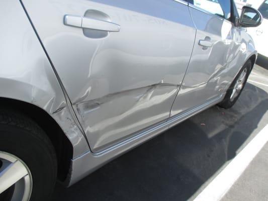 Before repair: 2013 Chevy Cruze/ Right side damage.