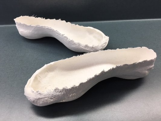 Plaster mold of a patient's foot that will be used to make custom orthotics. We have our orthotics made locally in Minneapolis, MN