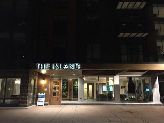 The Island Residences main entrance at night.