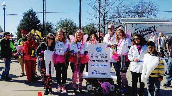 Some of our staff and their families at the annual Krewe of Barkus dog parade in downtown McKinney.