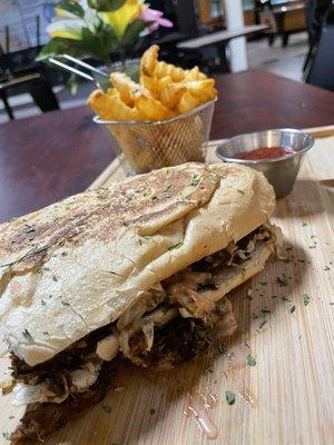 Pork sandwich with fries