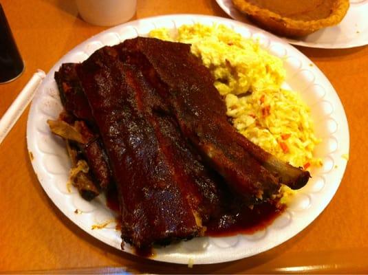 1/2 rack Pork BBQ ribs w/ potato salad & slaw, rounded off with sweet potato pie.  The BBQ has a spicy kick to it! I like it!