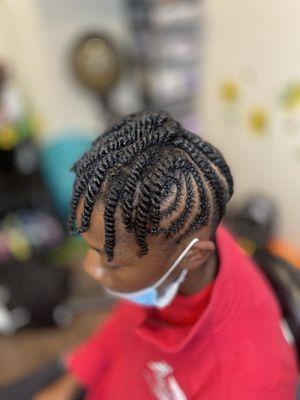 Braided updo with two-strand twists at the top