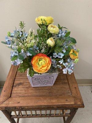 Beautiful! Artificial spring time flower arrangement.