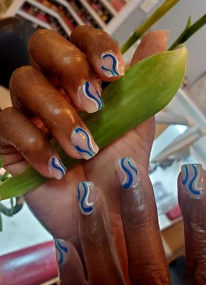 LOVELY blue and white design on powder dipped nails.