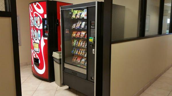 Vending machines are located in the hallway near parking entrance