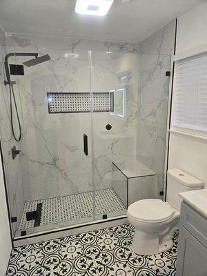 Full Custom Shower Project. 
Bench Seat, Built in Niche, French Drain, Rain shower head combo, Frameless Glass Door