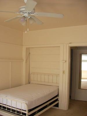 Murphy Bed folds up into wall if space is needed!