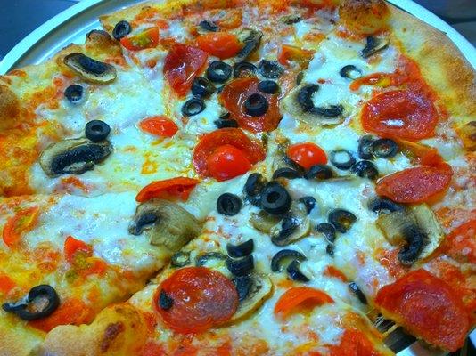 Pizza with Mushrooms,pepperoni and olives....Yummy.The crust is so good when u bite it feels like a cracker...amazing