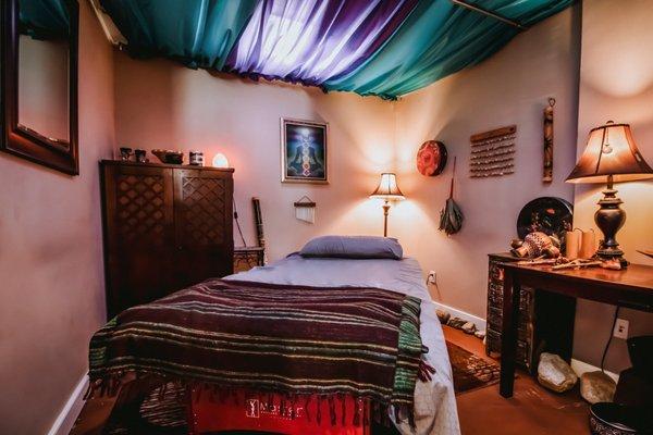 A serene and tranquil room dedicated to providing transformative healing experiences through the energy healing, sound healing, and more.