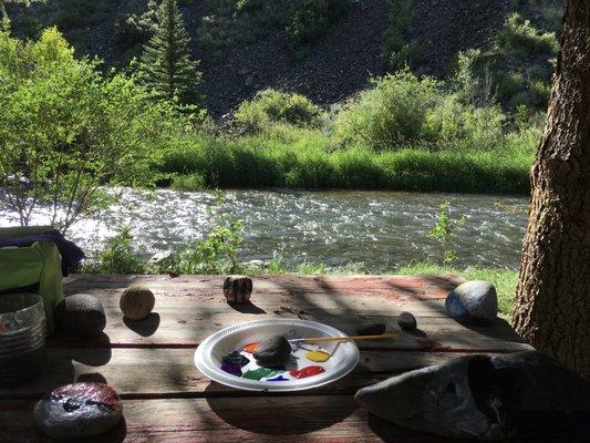 Painting rocks by the creek