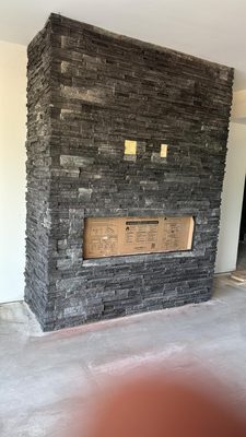 Stone work around a fireplace