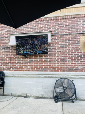 Two TVs on the patio for sports