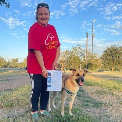 Katie receiving her AKC good citizen certificate.