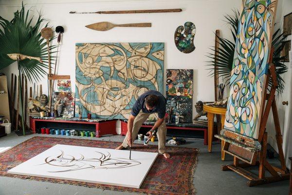 Alex Beard working in his painting studio. Photo by Bryan Tarnowski, Spring 2017.