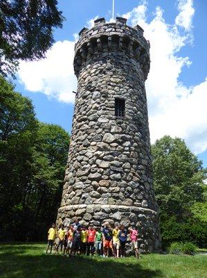 Catapult Engineering kids learn about stone tower construction at Regis College.