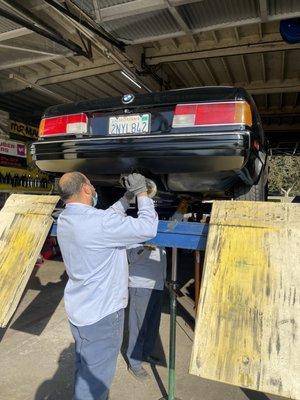 Juan fixing exhaust on an E24 like a champ!