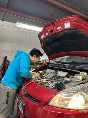 Man fixing car